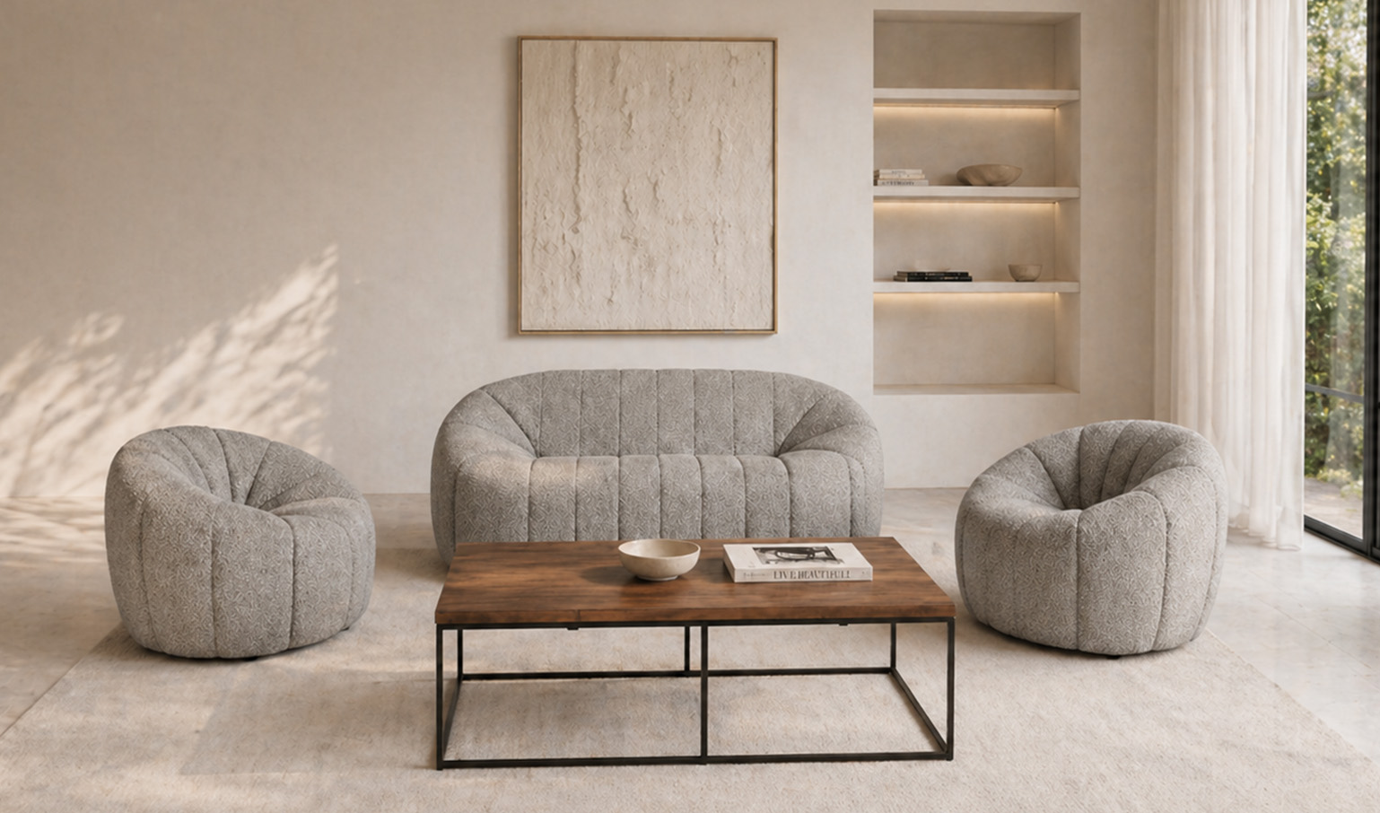 Modern sofa and lounge chairs set in a bright, elegant living room.